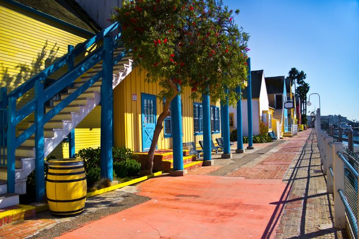 Fisherman's Village has colorful storefronts and a wide brick walk in Marina Del Rey, California.