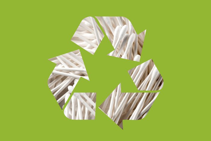 q tips in a recycle symbol on a green background