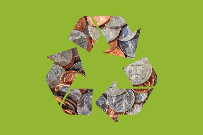 coins in a recycle symbol on a green background