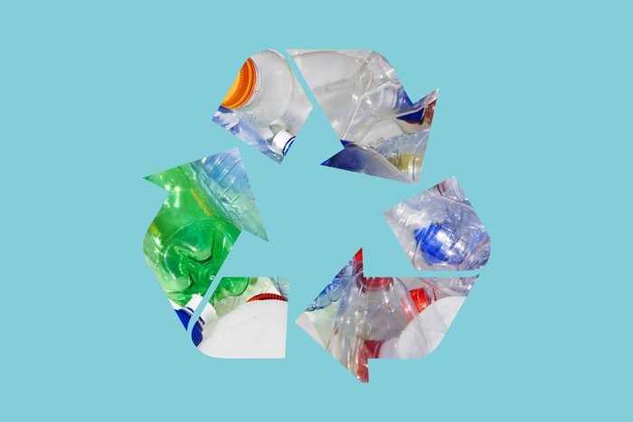 plastic bottles in a recycle symbol on a blue background