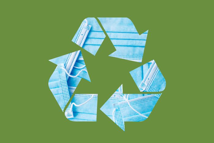 face masks in a recycle symbol on a green background