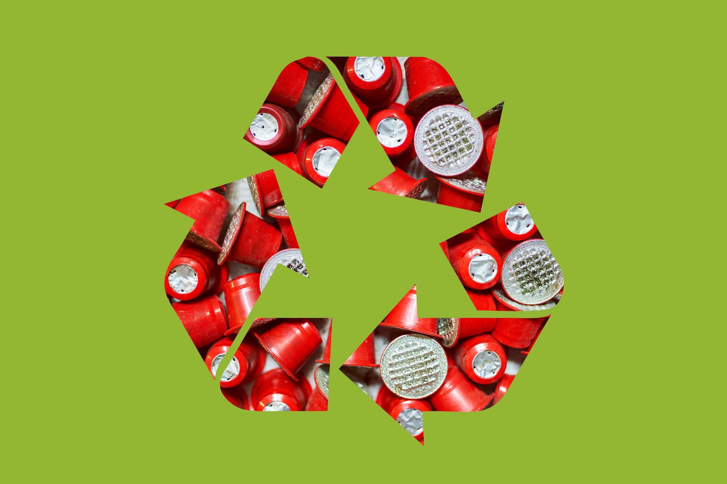 nespresso coffee pods in a recycle symbol on a green background
