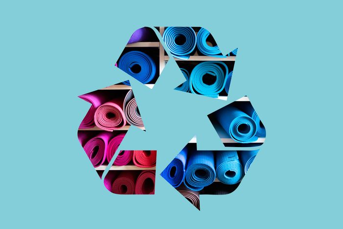 yoga mats in a recycle symbol on a blue background