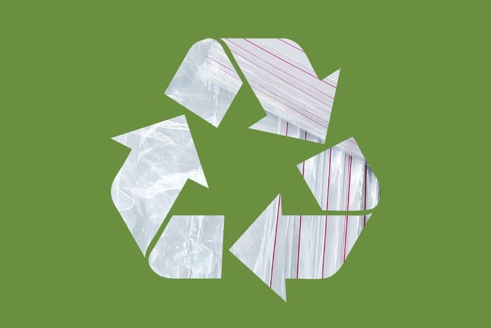 plastic ziplock bags in a recycle symbol on a green background