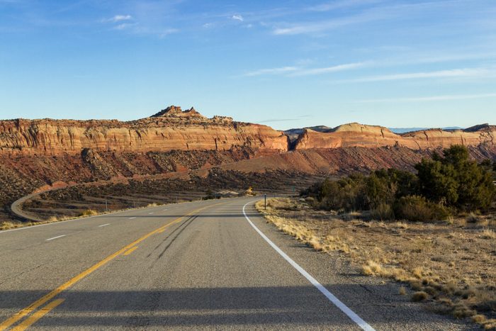 Scenic Highway 95 in Southeastern Utah with a beautiful sandstone wall intersected by the road