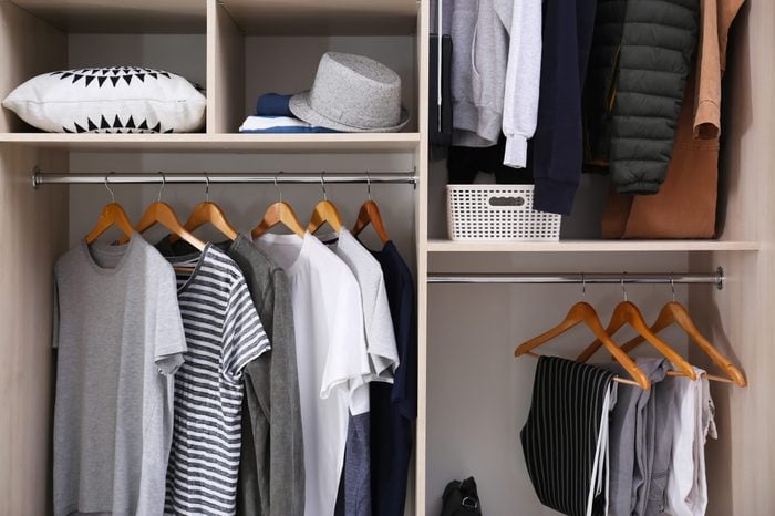 Stylish clothes and home stuff in large wardrobe closet