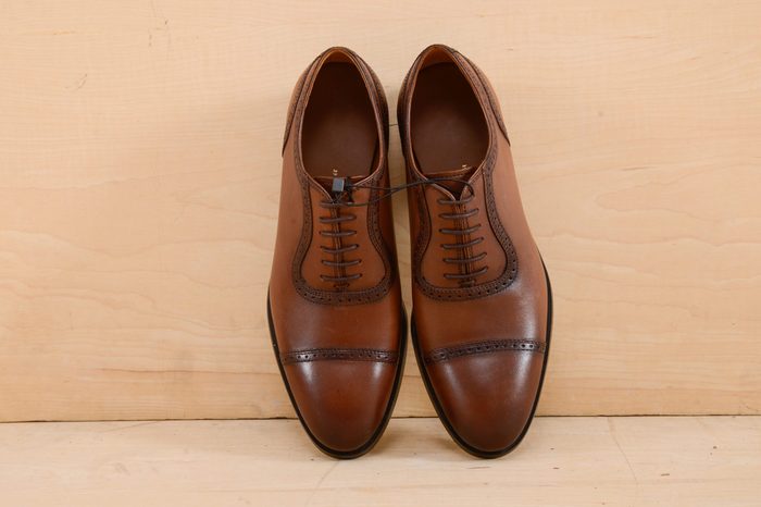 Set of men's shoes. Wooden background