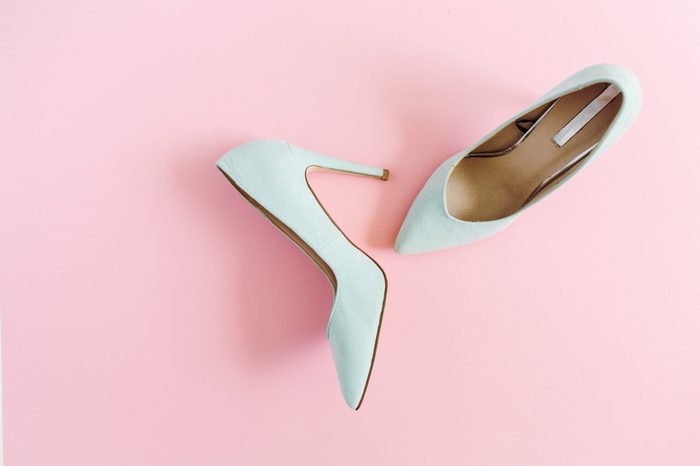 Fashion blog look. Pastel blue women high heel shoes on pink background. Flat lay, top view trendy beauty female background.