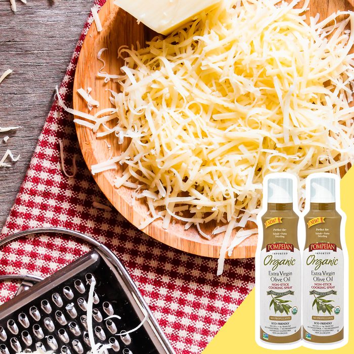 Olive oil spray in grated cheese