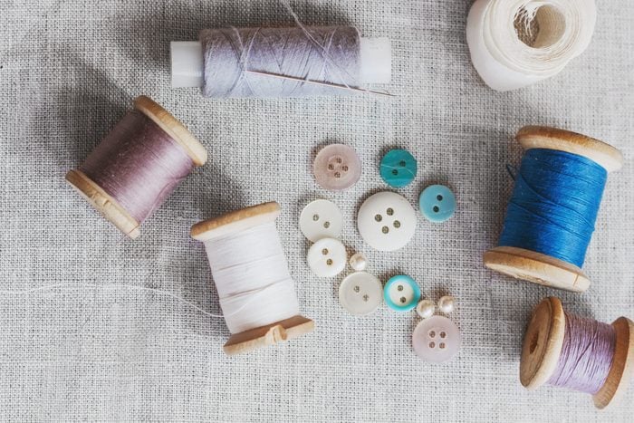 Sewing kit. Thread, needles and buttons.
