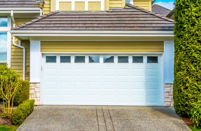Garage, garage doors and driveway.