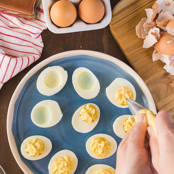Preparing deviled eggs with organic eggs for appetizer. Step by step recipe.; Shutterstock ID 515807359; Job (TFH, TOH, RD, BNB, CWM, CM): TOH