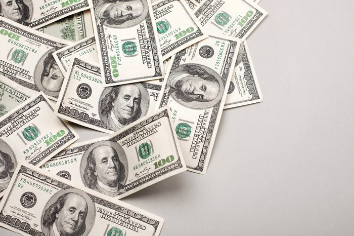 money american hundred dollar bills - horizontal on grey background