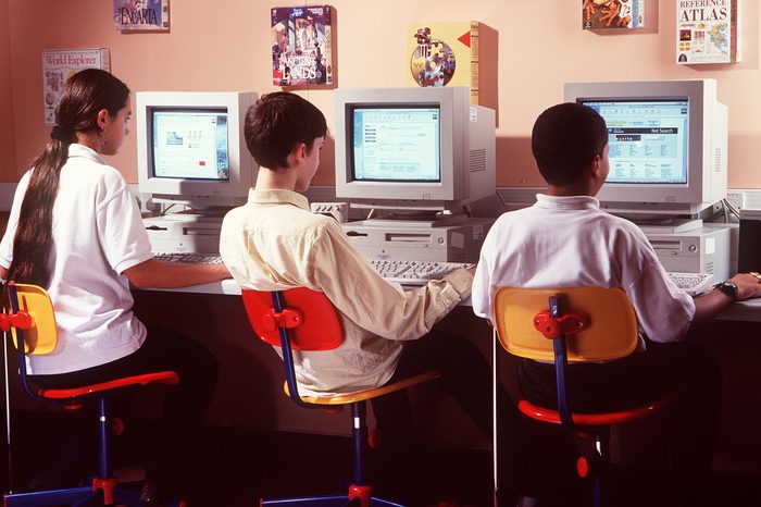 SCHOOL CHILDREN AT COMPUTERS