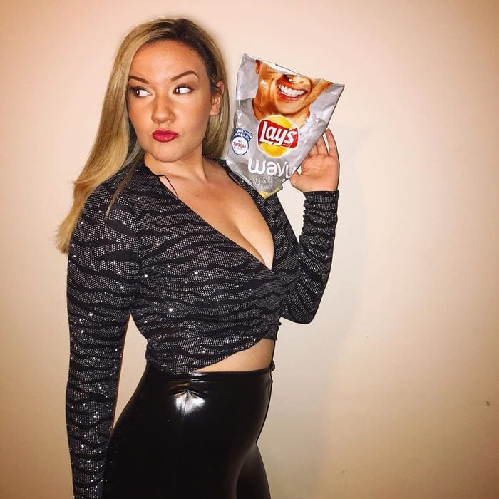woman dressed as "a chip on your shoulder" for halloween costume