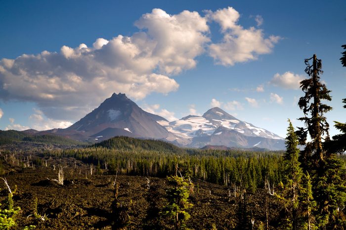 A seemingly endless field of lava leads out to the Sisters near Bend Oregon