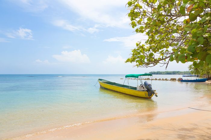 Boat at the beach of Boca del Drago, archipelago Bocas del Toro, Panama