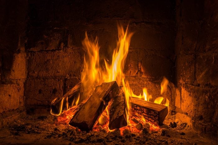 A fire burns in a fireplace, Fire to keep warm.