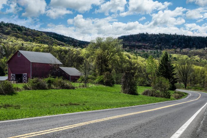 Scenic Drive in New York: Spring colors begin to show along a country road in the Catskill Mountains of southeastern New York.