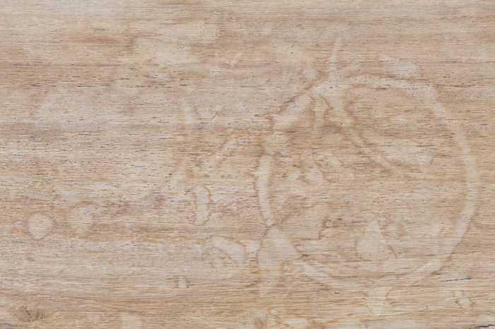 Water marks on a wooden table suitable for use as a background