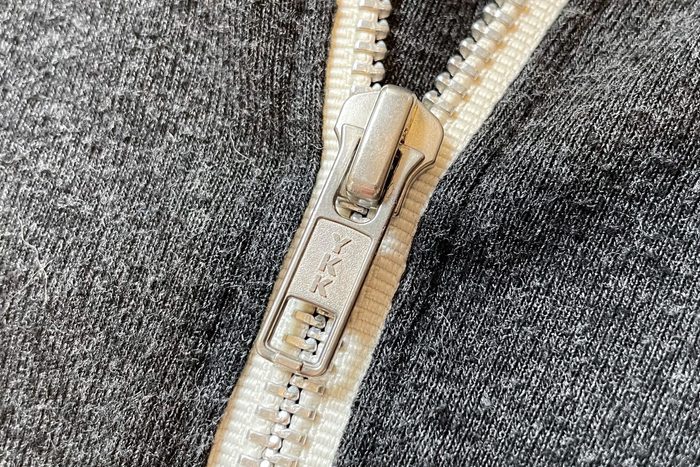 close up of zipper that says "YKK"