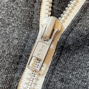 close up of zipper that says 