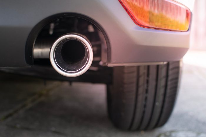 Close up, exhaust pipe of family car 