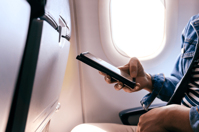 In Flight Wifi On Phone Airplane Gettyimages 1283920900