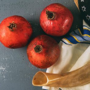 Honey and apples on shofar horn jewish holiday Rosh Hashanah torah book, kippah a yamolka talit