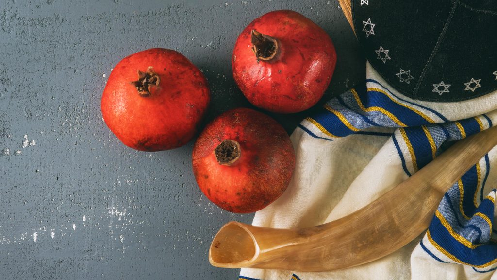 Honey and apples on shofar horn jewish holiday Rosh Hashanah torah book, kippah a yamolka talit