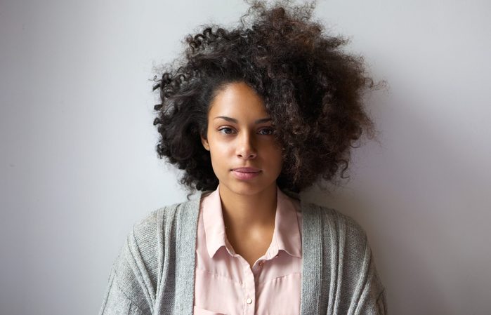 Close up portrait of a beautiful young woman with afro hairstyle