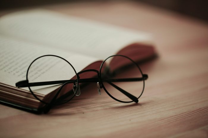 round glasses on book