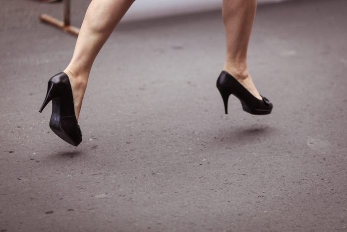Woman running on high heels