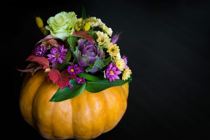 Festive Thanksgiving autumn flowers arrangement in a pumpkin