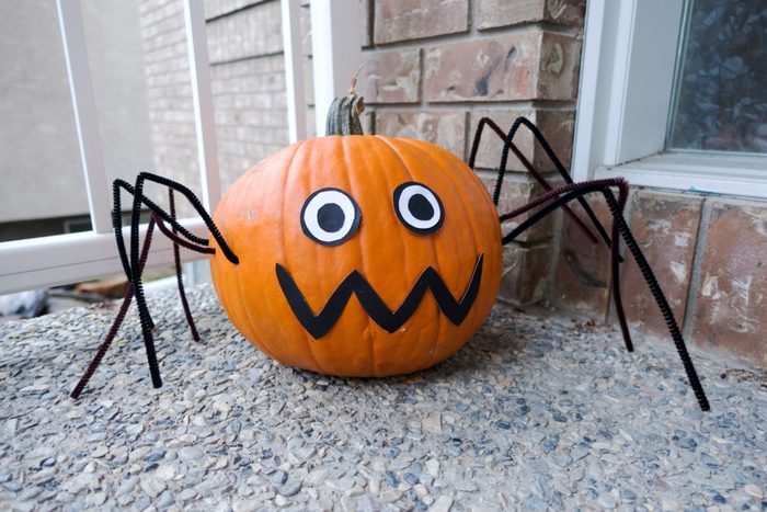 Picture of a spider pumpkin at the front door,made for Halloween.