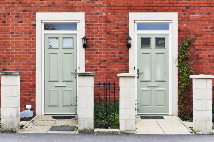 View of Front Doors of Two Neighbouring Red Brick English Town Houses on a Residential Estate