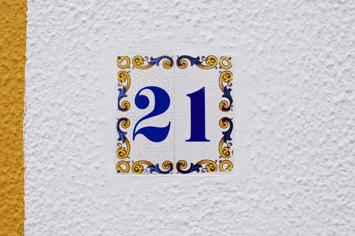 ceramics house number on the wall twenty one