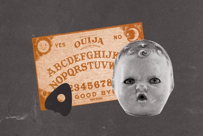 Ouija board and planchette with doll head