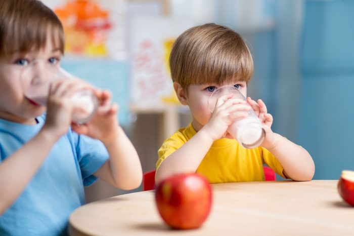 children eating healthy food at home or kindergarten
