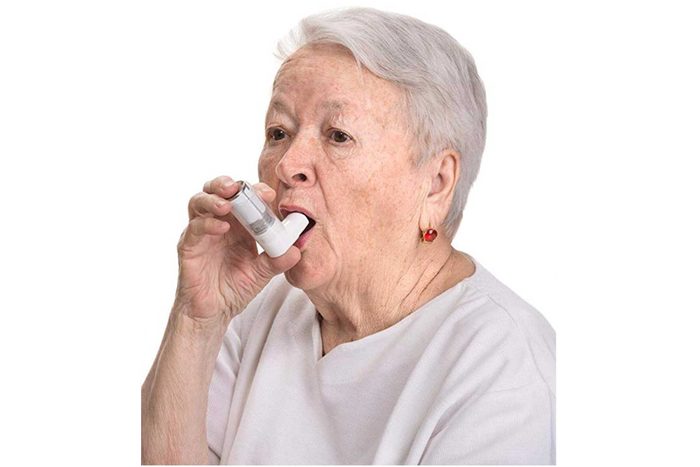 elderly woman using inhaler wall sticker