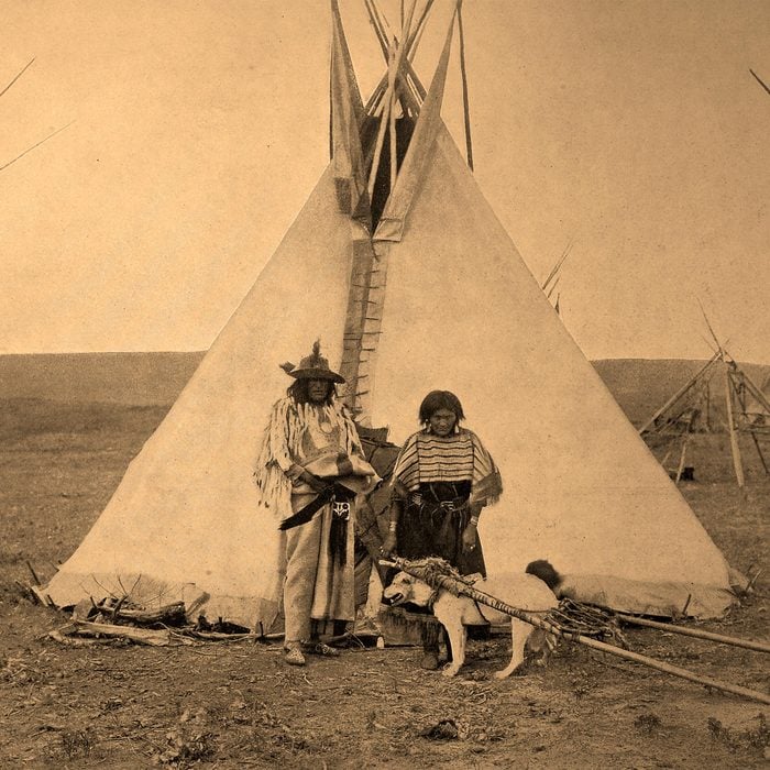 Indian Chief with his wife in front of their tent, historical photo, United states of America 2010s