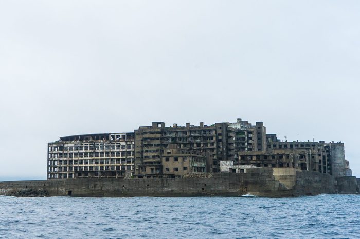 Hashima Island in Nagasaki, Japan. Also called Battleship Island. A symbol of the rapid industrialization of Japan. It is a UNESCO World Heritage site.