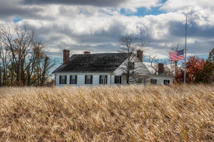 The US flag flies over the historic Seabrook Wilson house in Bayshore Waterfront Park in Monmouth County New Jersey.