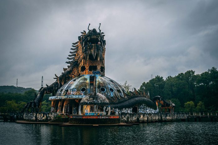 Dark tourism attraction Ho Thuy Tien abandoned waterpark, close to Hue city, Central Vietnam, Southeast Asia. Famous Dragon statue in the middle of the waterpark.