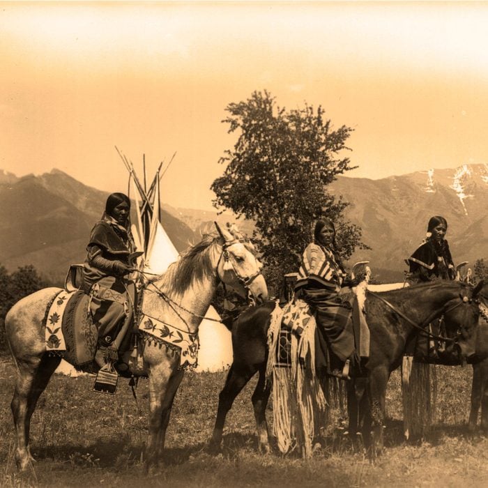 Shoshone Indian women c1895 with their horses decked out in an impressive display of beadwork.