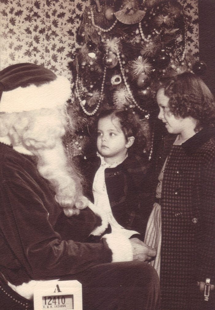 This is one of those pictures that brings back wonderful childhood memories. It was taken at Lazarus Department store in downtown Columbus Ohio. Lazarus is long gone; but not forgotten. Going to Lazarus was always a great adventure when we were children. At least one whole floor was dedicated to children; all year round. Their street level windows were always filled with beautiful displays at Christmas time.I am the younger of the two sisters in this picture. My sister Linda is with me. This is also the only picture I have that includes Santa. It was taken in 1955.