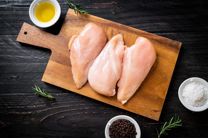 fresh chicken breast raw on cutting board