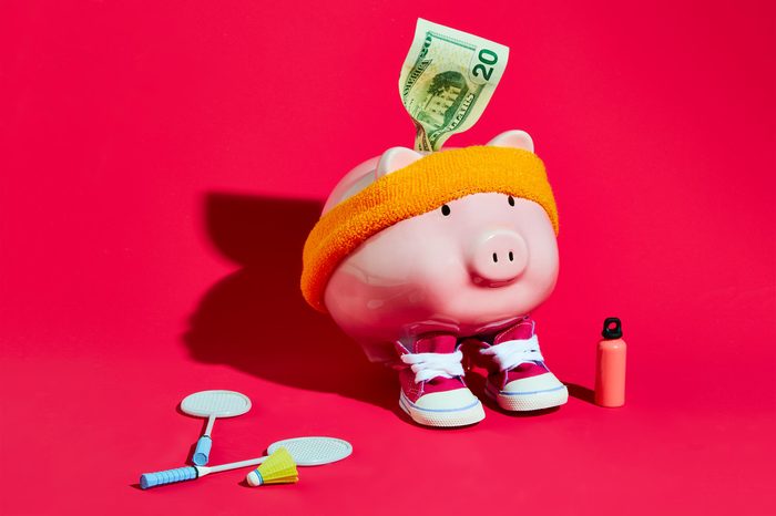 piggy bank wearing a sweatband and sneakers concept photography by sarah anne ward