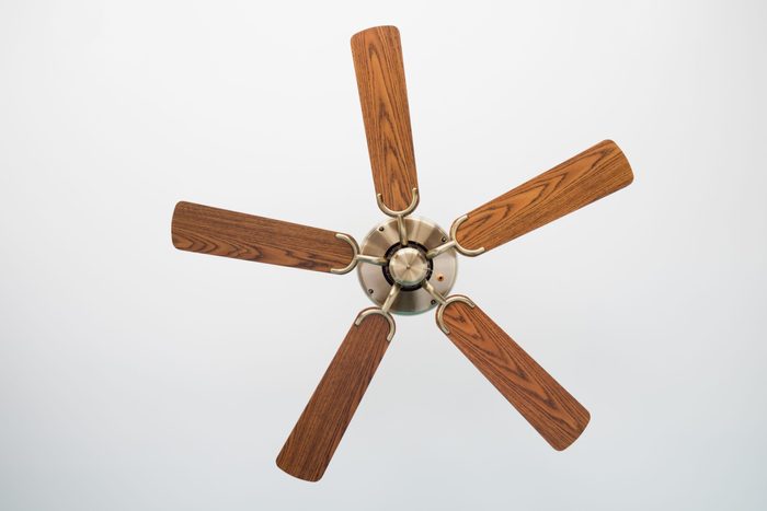 Electric ceiling fan,Picture of wooden ceiling fan inside the living room.