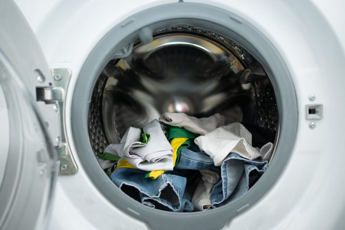 Dirty clothes in washing machine drum